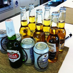 a variety of beer cans and beer bottles